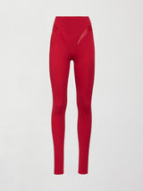 An image of a pair of sleek, high waisted bright red leggings with shiny contoured hip detailing lines. 