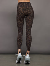 Model wears high waisted brown leopard print leggings. 