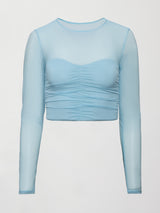 A long sleeve sky blue top with a ruched sweetheart chest and sheer long sleeves. 