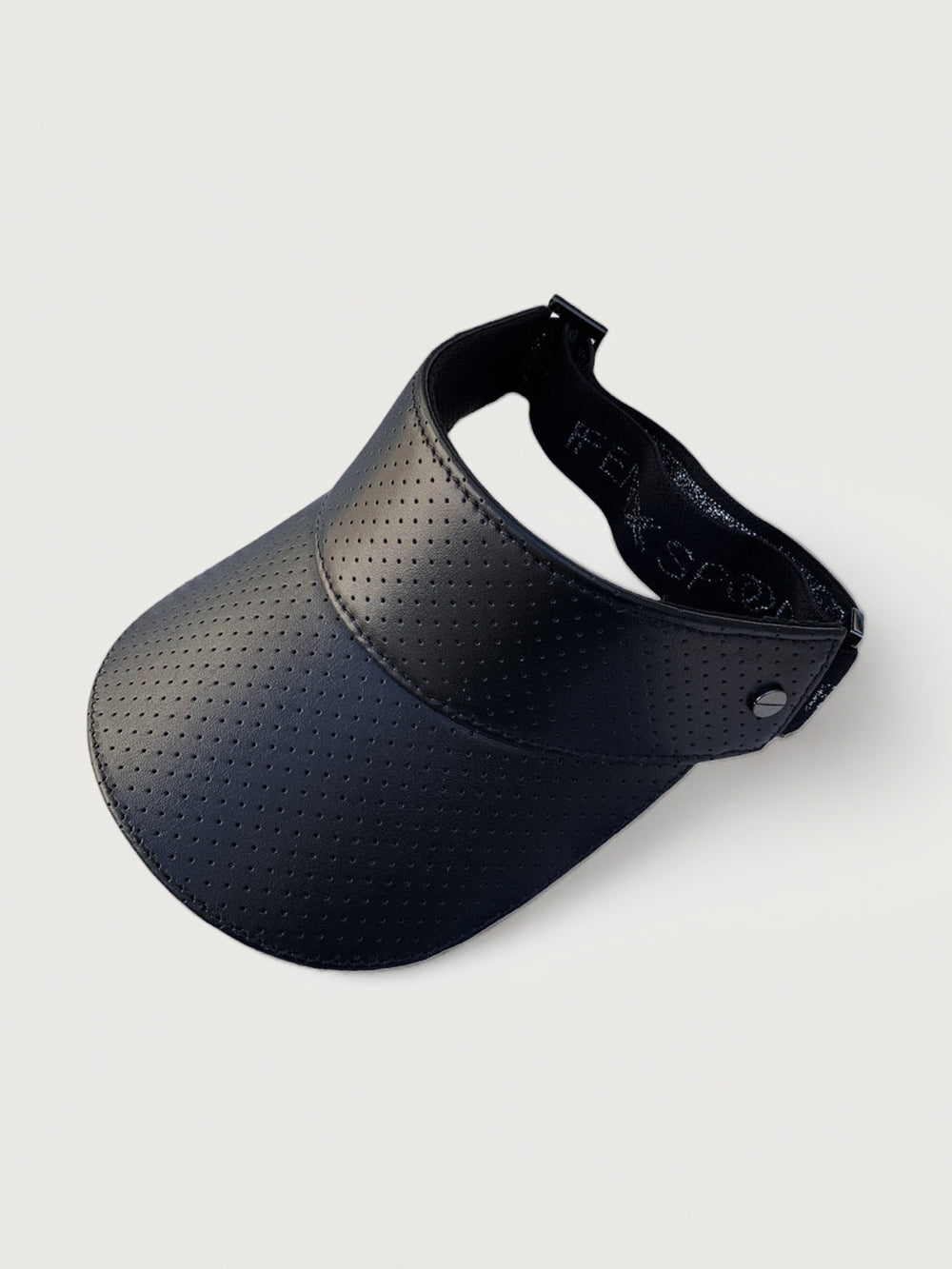 A black mesh textured shiny visor with a thick black strap that says Fenix Sportier. 